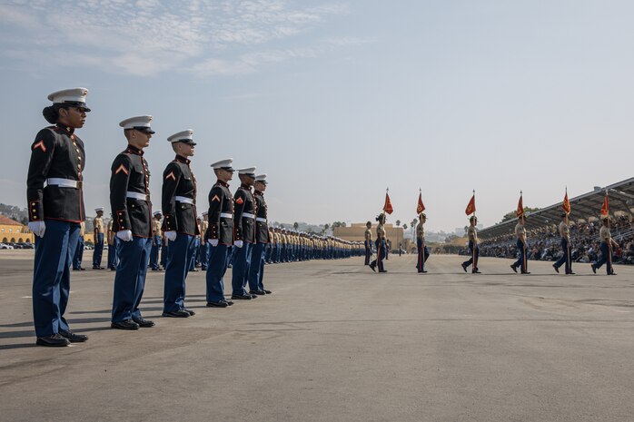 U.S. Marines with Lima Company, 3rd Recruit Training Battalion, retire the guidons during a graduation ceremony at Marine Corps Recruit Depot San Diego, California, Oct. 4, 2024. Graduation took place at the completion of the 13-week transformation, which included training for drill, marksmanship, basic combat skills, and Marine Corps customs and traditions. (U.S. Marine Corps photo by Cpl. Sarah M. Grawcock)
