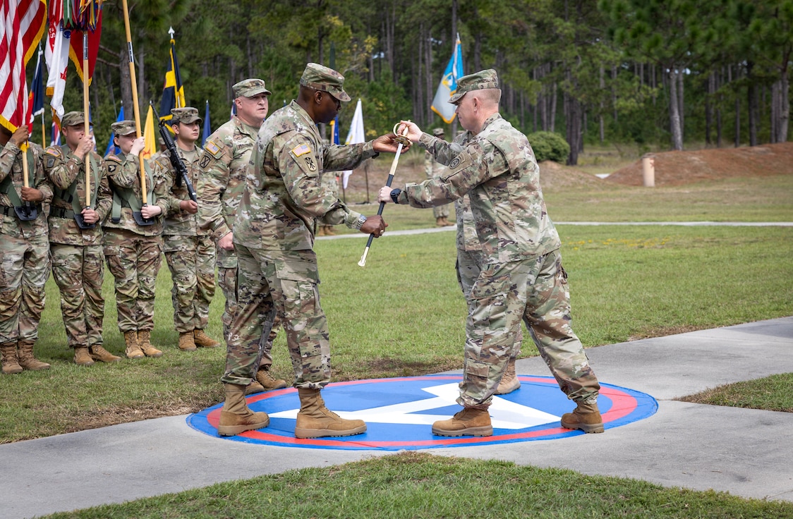 U.S. Army Central “Patton’s Own”, Lt. Gen. Patrick Frank, USARCENT commanding general, passes the Sword of the Noncommissioned Officer to the incoming Command Sgt. Maj. Eric R. McCray, at Patton Hall’s Lucky Park, Shaw Air Force Base, S.C., Oct. 10, 2024.