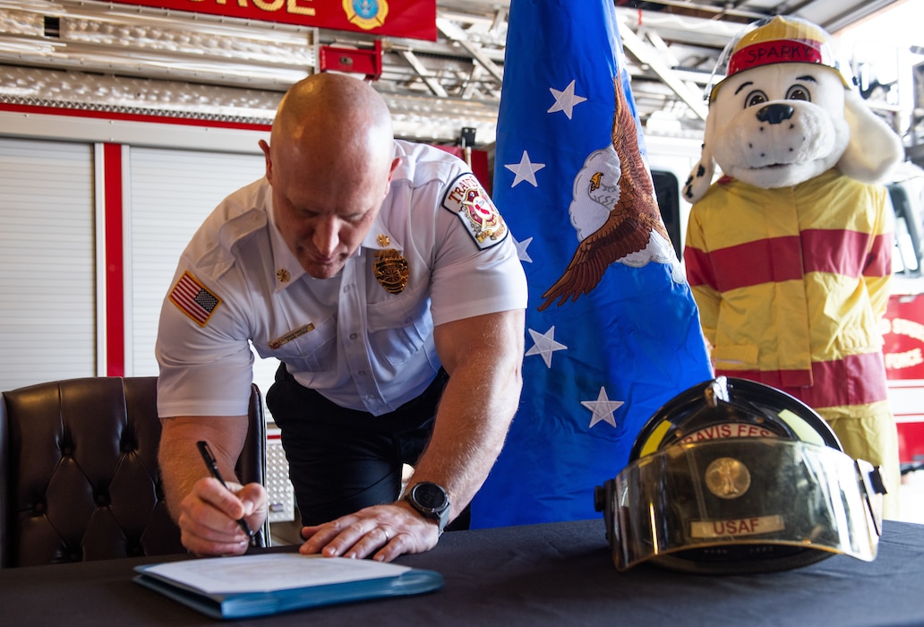 Fire chief signs proclamation