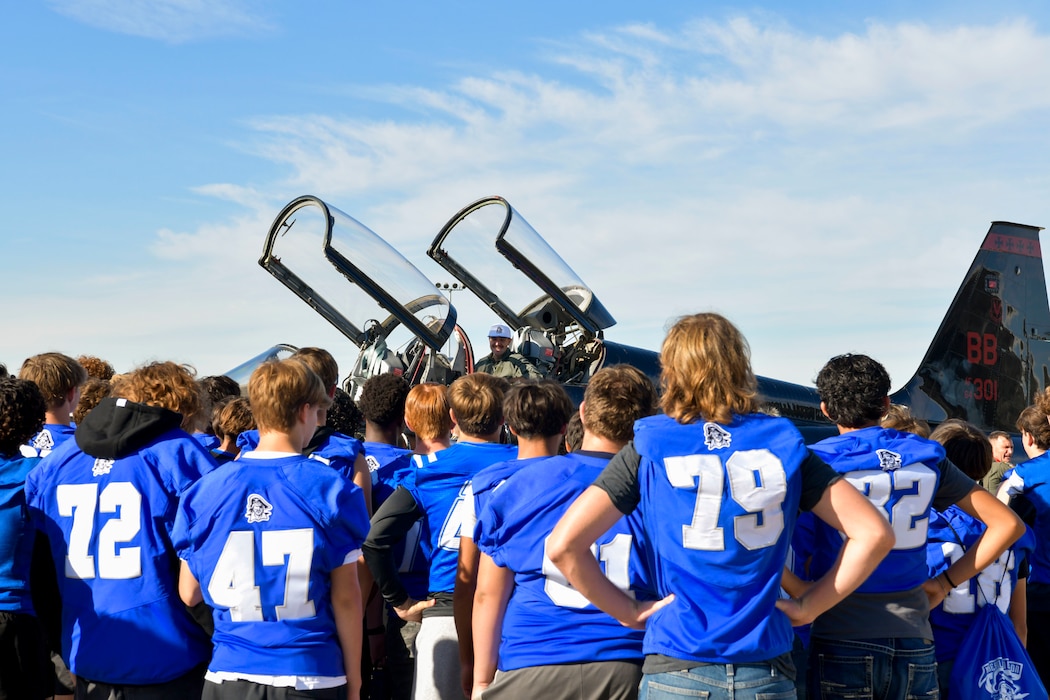 Students from Wheatland Union High School gather around a U.S. Air Force T-38 Talon to greet their coach, U.S. Air Force Reserve Tech. Sgt. Joshua Crawley, after his flight at Beale Air Force Base, California, Oct. 9, 2024