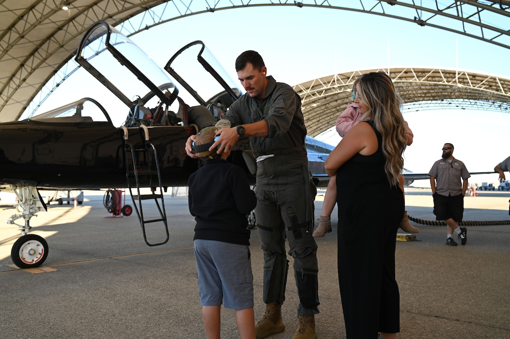 U.S. Air Force Reserve Tech. Sgt. Joshua Crawley places hearing protection on his son before his flight on a U.S. Air Force T-38 Talon at Beale Air Force Base, California, Oct. 9, 2024