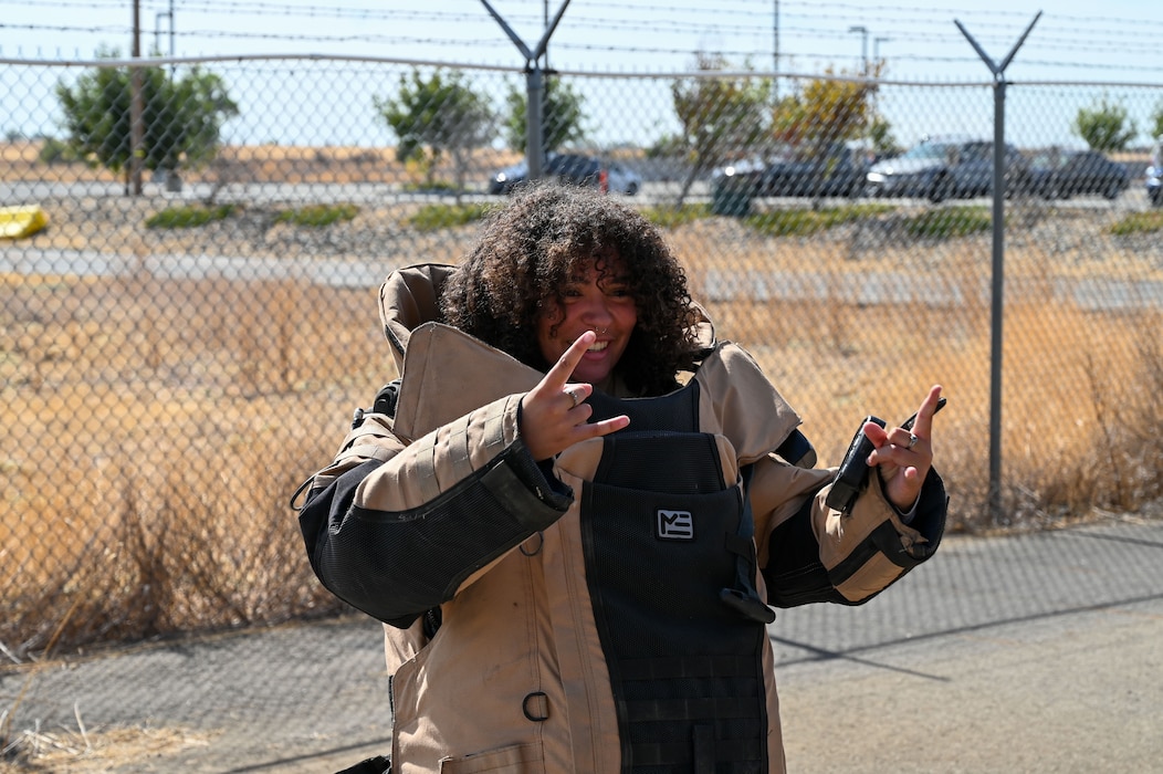 A Wheatland Union High School student poses in an Explosive Ordinance Disposal suit during a base tour at Beale Air Force Base, California, Oct. 9, 2024