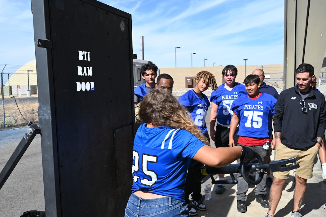 Wheatland Union High School student Jaeda Wolfe uses a battering ram to breach a door during a 9th Security Forces Squadron demonstration at Beale Air Force Base, California, Oct. 9, 2024.