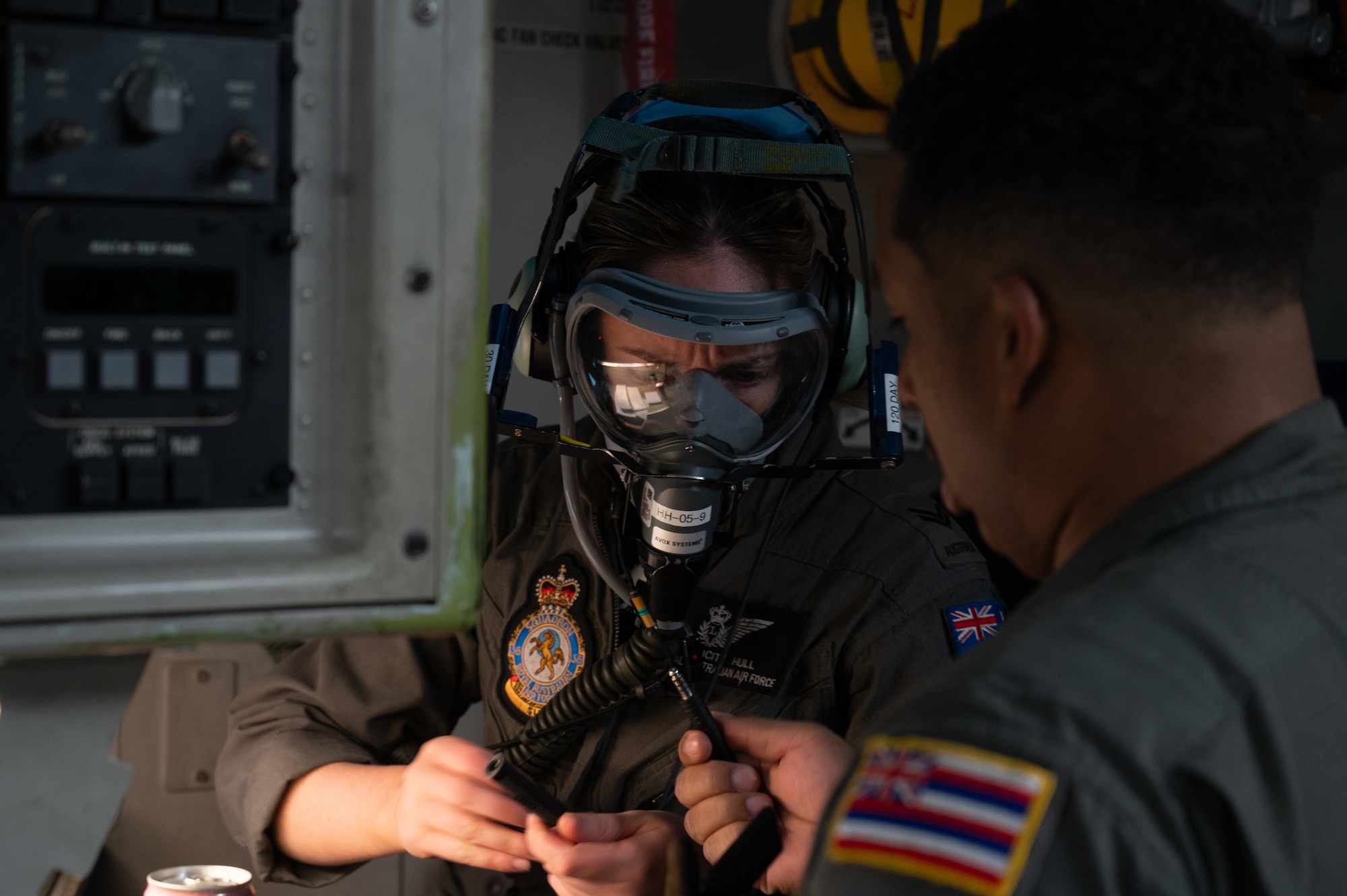 Royal Australian Air Force Corporal wears an oxygen mask during flight pre-checks on a C-17 Globemaster III aircraft.