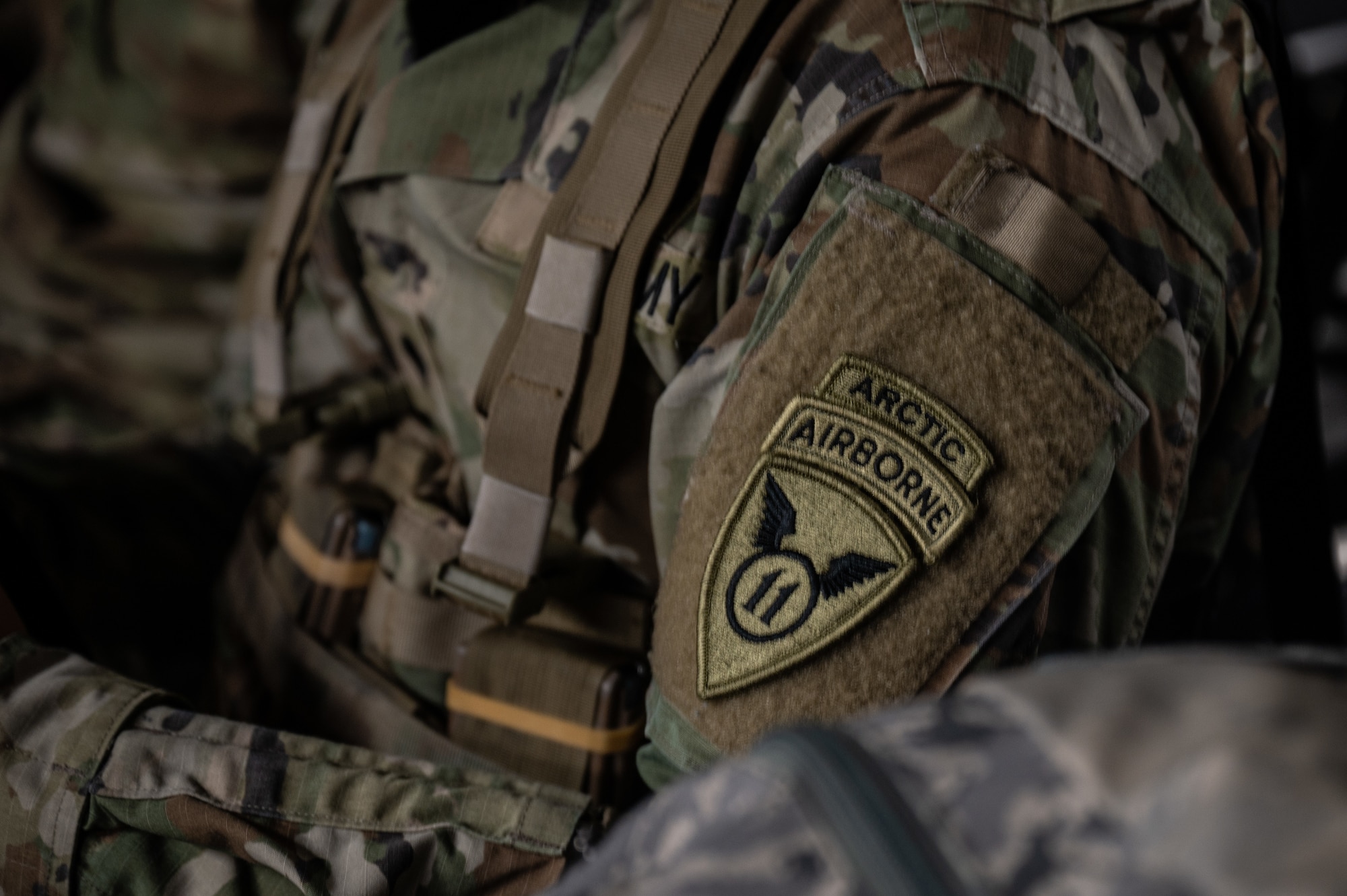 A close-up photo of a U.S. Army Soldiers patch for the 11th Air Borne Division alongside an artic and airborne tab above the patch.