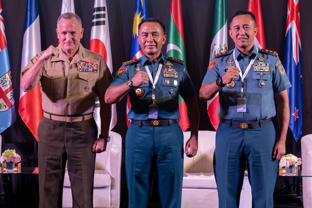 U.S. Marine Corps Lt. Gen. William M. Jurney, left, commander, U.S. Marine Corps Forces, Pacific,  Indonesian Navy Lt Gen. Suhartono, center, commander, Naval Doctrine, Education and Training Development Command, and Indonesian Marine Corps Maj. Gen. Nur Alamsyah, commandant, Korps Marinir Republik Indonesia, pose for a photo during a panel discussion at Pacific Amphibious Leaders Symposium 2023, Bali, Indonesia, July 11, 2023. PALS consists of discussions, engagements and presentations which fortify cooperation, confront common threats, protect shared resources, and uphold sovereignty in the Indo-Pacific Region. This year's symposium hosts senior leaders from 24 participating nations who are committed to a free and open Indo-Pacific, with the objective of strengthening and developing regional relationships. (U.S. Marine Corps photo by Lance Cpl. Blake Gonter)