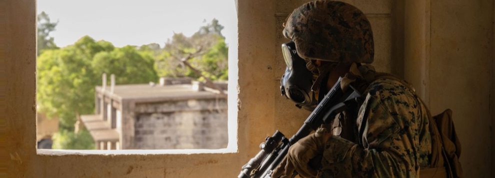 241002-M-KK895-1097 OKINAWA, Japan (Oct. 2, 2024) U.S. Marine Corps Lance Cpl. Marc Galecia holds security during Exercise Samurai 24.2 at the Central Training Area, Camp Hansen, Okinawa, Japan, Oct. 2, 2024. Samurai Exercises are designed to train Marines from non-infantry marine occupational specialty backgrounds on the fundamentals of the command operations center defense. Galecia is an inventory management specialist assigned to Headquarters Battalion, 3d Marine Division. (U.S. Marine Corps photo by Lance Cpl. Cara Castañeda)