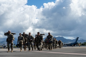 U.S. Army Soldiers from the 11th Airborne Division arrive on Joint Base Pearl Harbor-Hickam, Hawaii, Oct. 7, 2024 during Joint Pacific Multinational Readiness Center 25-01. The Joint Pacific Multinational Readiness Center (JPMRC) is the Army’s newest Combat Training Center (CTC) and generates readiness in the environments and conditions where our forces are most likely to operate in. JPMRC 25-01 includes training participants from across the U.S. Joint Force, and multinational Allies and partners. (U.S. Air Force photo by Airman 1st Class Aden Brown)