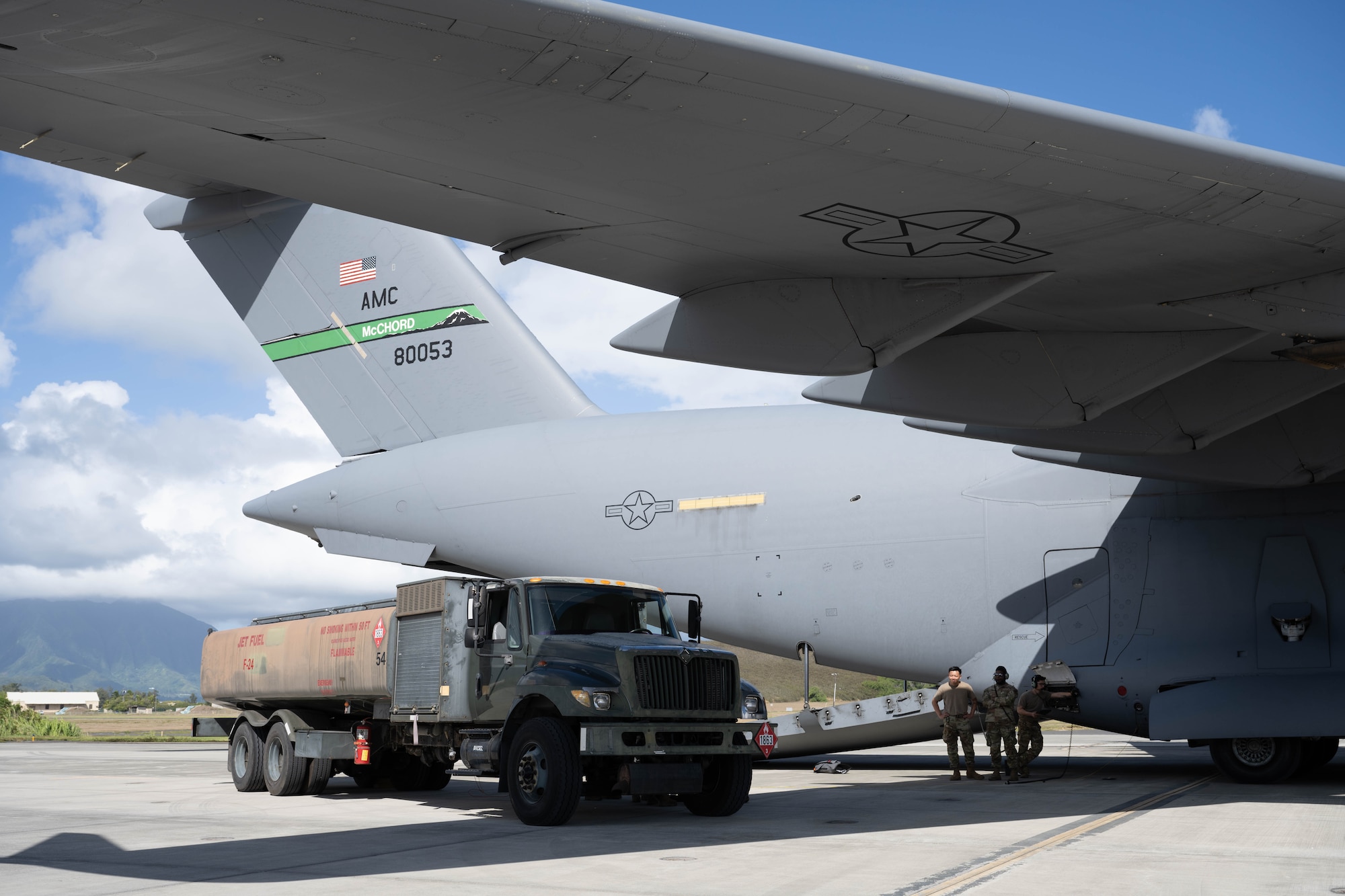 U.S. Air Force Airmen with the 7th Airlift Squadron transfer fuel using the C-17 Globemaster III and the R-11 Refueler on the flightline of Marine Corps Base Hawaii during exercise Joint Pacific Multinational Readiness Center 25-01, Oct. 9, 2024. The Joint Pacific Multinational Readiness Center (JPMRC) is the Army’s newest Combat Training Center (CTC) and generates readiness in the environments and conditions where our forces are most likely to operate in. JPMRC 25-01 includes training participants from across the U.S. Joint Force, and multinational Allies and partners. (U.S. Air Force photo by Airman 1st Class Aden Brown)
