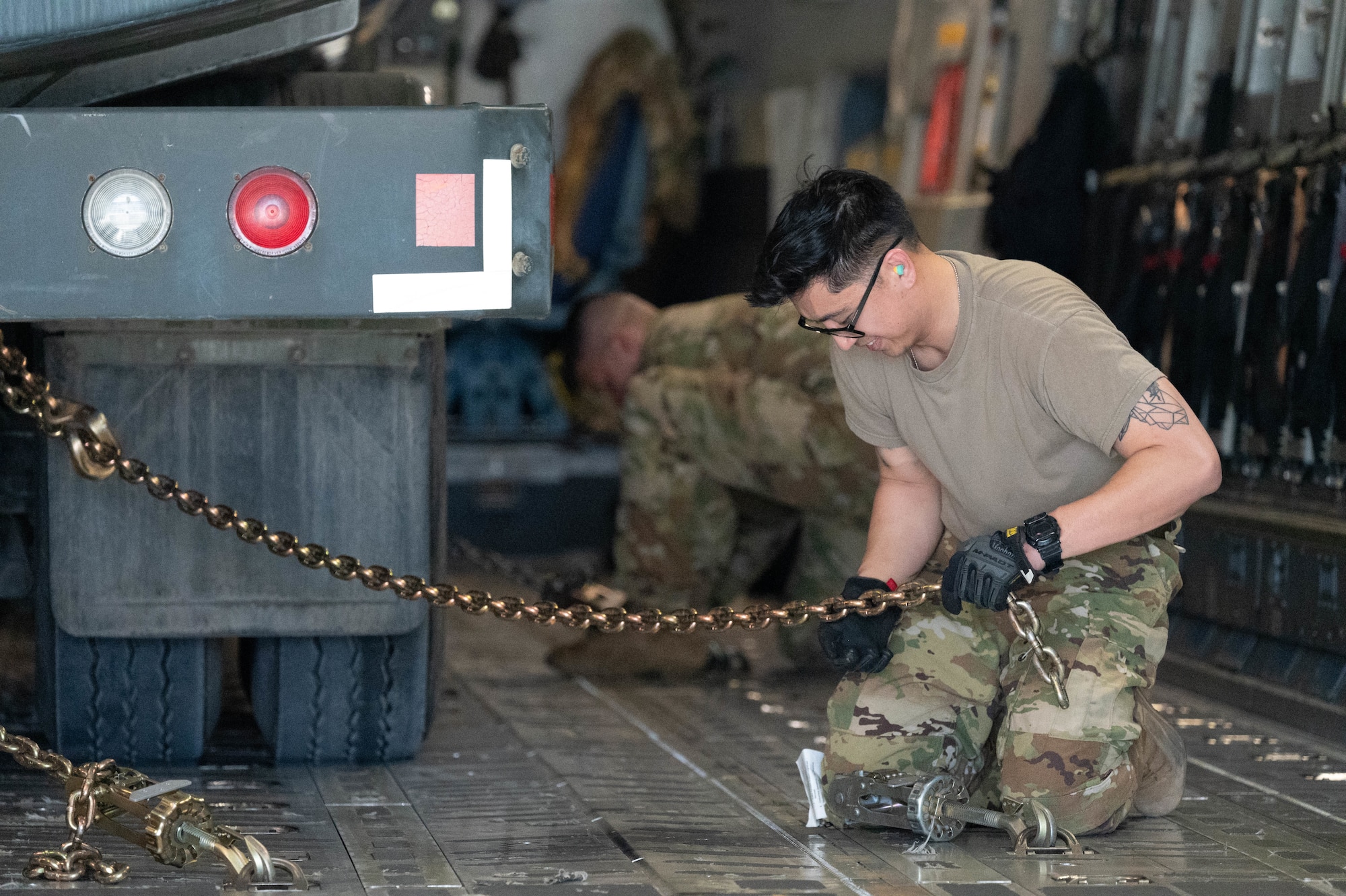 U.S. Air Force Airmen load an R-11 Refueler in a C-17 Globemaster III on Marine Corps Base Hawaii during exercise Joint Pacific Multinational Readiness Center 25-01, Oct. 9, 2024. The Joint Pacific Multinational Readiness Center (JPMRC) is the Army’s newest Combat Training Center (CTC) and generates readiness in the environments and conditions where our forces are most likely to operate in. JPMRC 25-01 includes training participants from across the U.S. Joint Force, and multinational Allies and partners. (U.S. Air Force photo by Airman 1st Class Aden Brown)