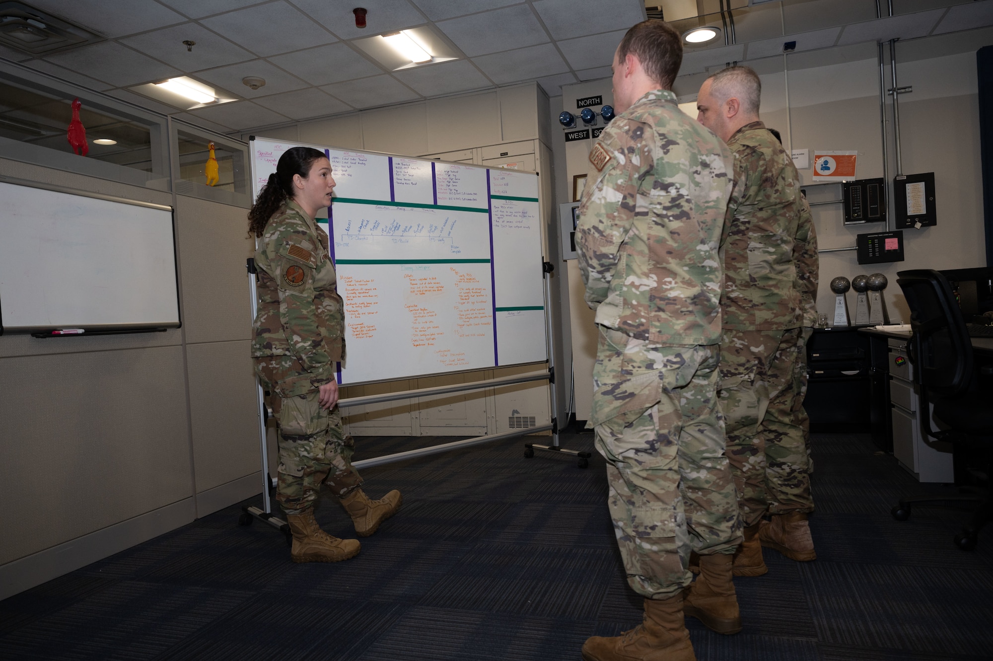 U.S. Air Force Master Sgt. Brandi Parkhurst, 83d Network Operations Squadron weapons and tactics, instructs Airmen at Joint Base Langley-Eustis, Virginia, Oct. 8, 2024. Parkhurst synchronizes weapon system effects by planning out and executing the mission. (U.S. Air Force photo by Airman Donnell Ramsey)