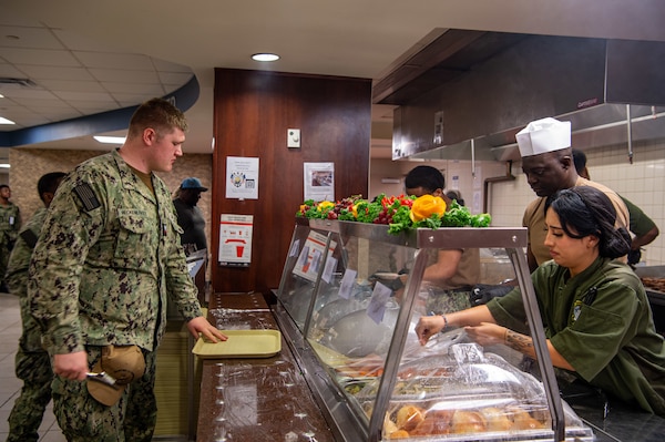 Portsmouth, VA (Oct. 10, 2024) Culinary Specialists serve food in Naval Medical Center Portsmouth (NMCP) Galley during a meal dedicated to the U.S. Navy's 249th Birthday. The U.S. Navy was established Oct. 13, 1775, and is celebrated every year at commands throughout the U.S. Navy. (U.S. Navy photo by Mass Communication Specialist 2nd Class Thomas Boatright)