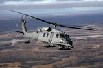 An Alaska Air National Guard HH-60G Pave Hawk helicopter assigned to the 210th Rescue Squadron flies over Joint Base Elmendorf-Richardson, Alaska, while conducting a training operation Oct. 2, 2024. The Pave Hawk is the 176th Wing’s primary platform for personnel extraction.