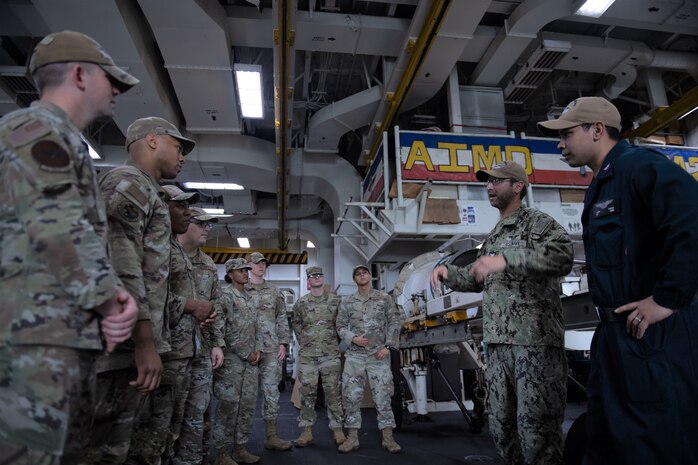 The Nimitz-class aircraft carrier USS Dwight D. Eisenhower (CVN 69) (IKE) hosted Airmen from the U.S. Air Force 1st Fighter Wing (FW) while underway off the coast of Florida for carrier qualifications, Sep. 20-26. (U.S. Navy photo by Mass Communication Specialist Seaman Apprentice Theodore Morrison)