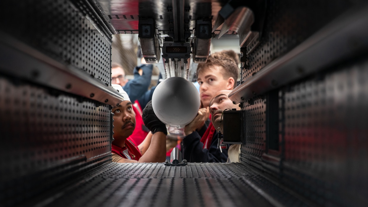 Sailors load a RIM 162-D1 Evolve Sea Sparrow missile aboard USS George Washington (CVN 73) in the Pacific Ocean.