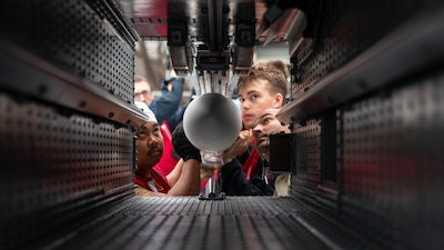 Sailors load a RIM 162-D1 Evolve Sea Sparrow missile aboard USS George Washington (CVN 73) in the Pacific Ocean.