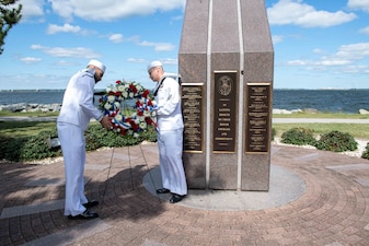 LS2 Wilfredo Cerezo-Rodriguez and LS1 Robert Jordan lay a wreath at the USS Cole (DDG 67) Memorial on Naval Station Norfolk.