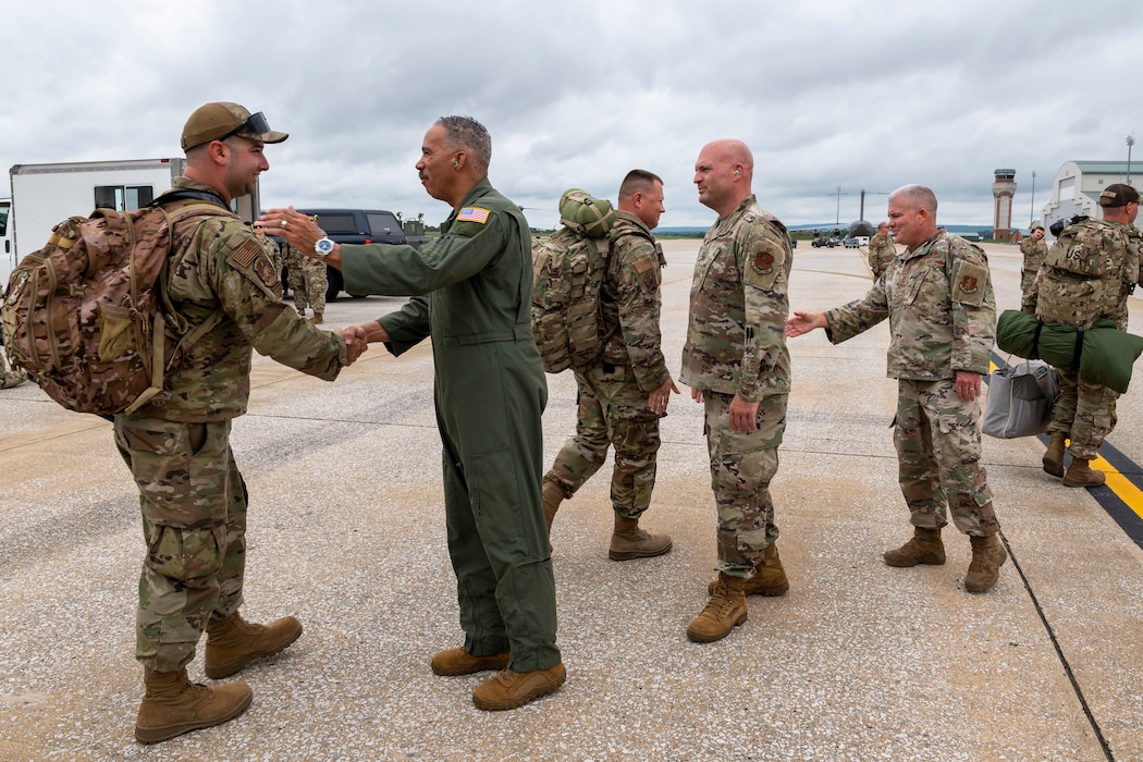 men in uniforms shake hands