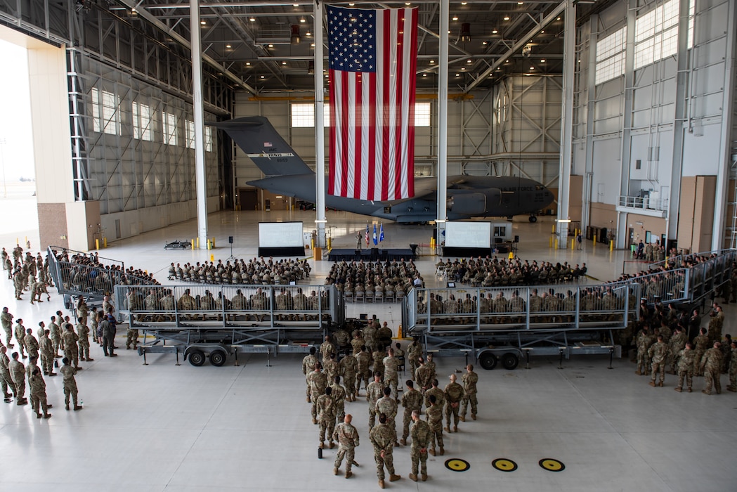 an overall photo of airmen and leaders gathering