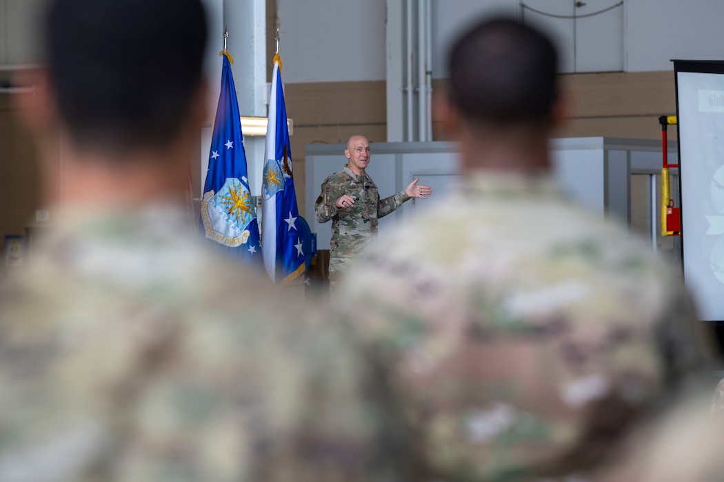 an officer is giving speech to airman