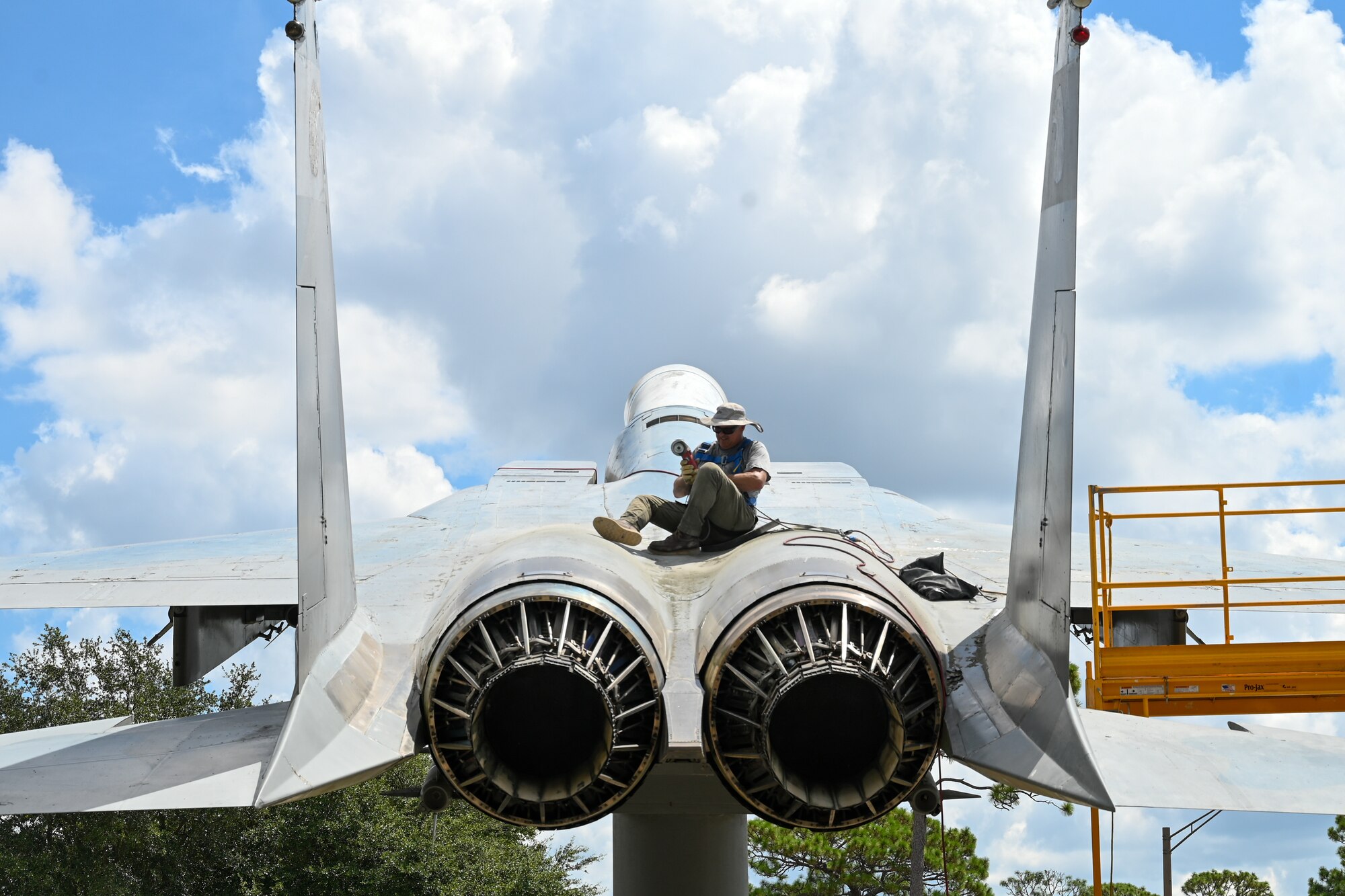 A photo of a man sitting on a jet.