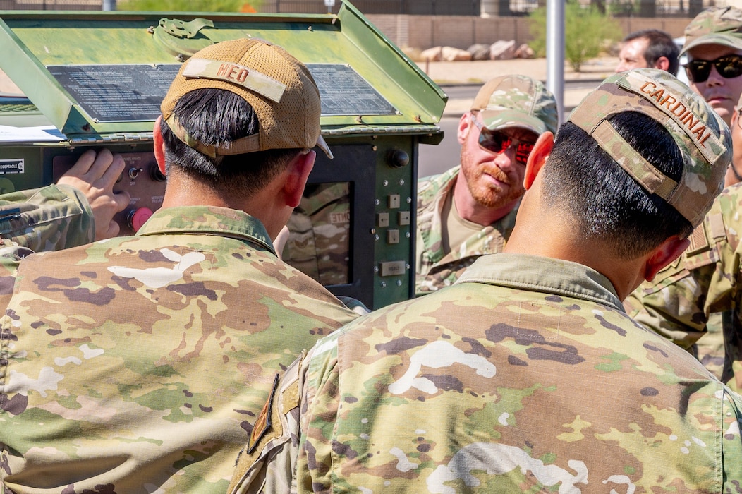 U.S. Air Force Staff Sgt. David Heo, 56th Civil Engineer Squadron power production technician, teaches Airmen how to operate a portable generator.