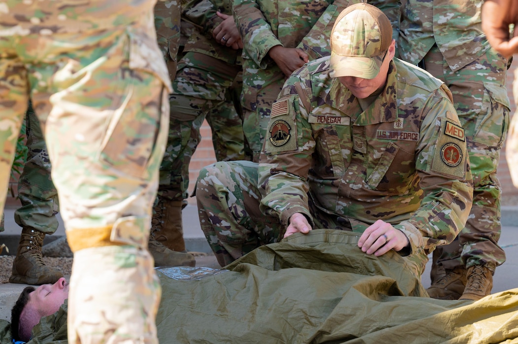 U.S. Air Force Tech. Sgt. Brandon Henegar, 56th Medical Group element chief of the operational medicine clinic, provides a demonstration to Airmen on effectively managing casualties in a deployed setting.