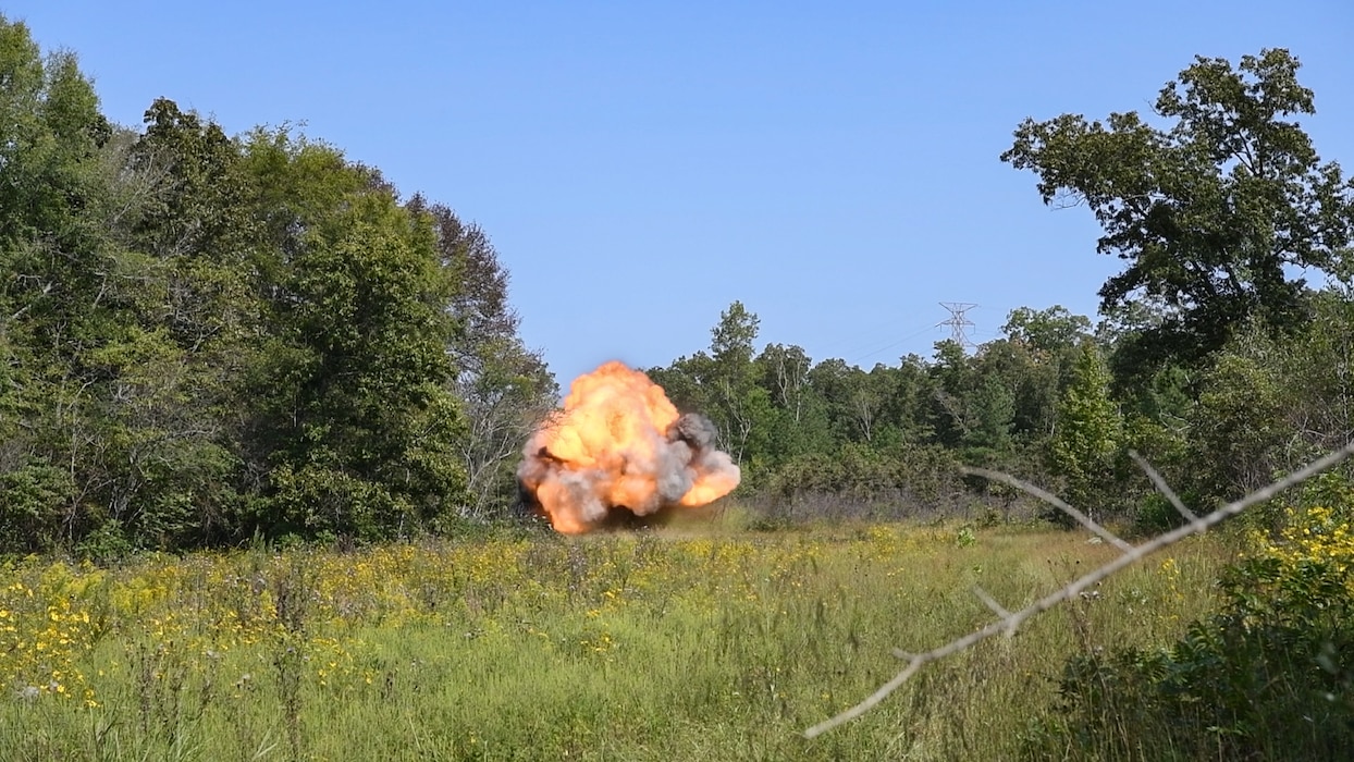 Leftover explosive test materials and items containing residue from a recent test are destroyed during an explosives disposal Sept. 10, 2024, at Arnold AFB, Tenn., headquarters of Arnold Engineering Development Complex. The 96th Civil Engineer Squadron Explosive Ordnance Disposal Flight from Eglin Air Force Base, Florida, helped plan both the testing and the disposal of the remaining explosives. These materials were detonated in a remote area of Arnold AFB using a charge of explosives. (U.S. Air Force still image pulled from video shot by Keith Thornburgh)