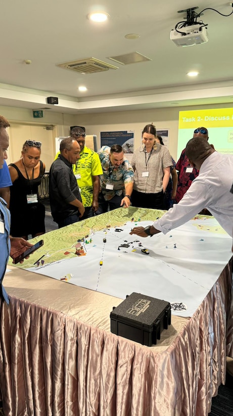 Representatives from the Vanuatu Maritime Safety Authority and the U.S. Coast Guard address participants during a tabletop exercise at a marine pollution workshop in Honiara, Solomon Islands, Oct. 10, 2024. U.S. Coast Guard personnel with the Marine Environmental Response Regional Activity Center joined delegates from Solomon Islands, Vanuatu, Fiji, Kiribati, Australia, and Samoa to collaborate and prepare for marine pollution emergencies in the Pacific. (U.S. Coast Guard photo by Chief Warrant Officer 3 Shannon McGregor)