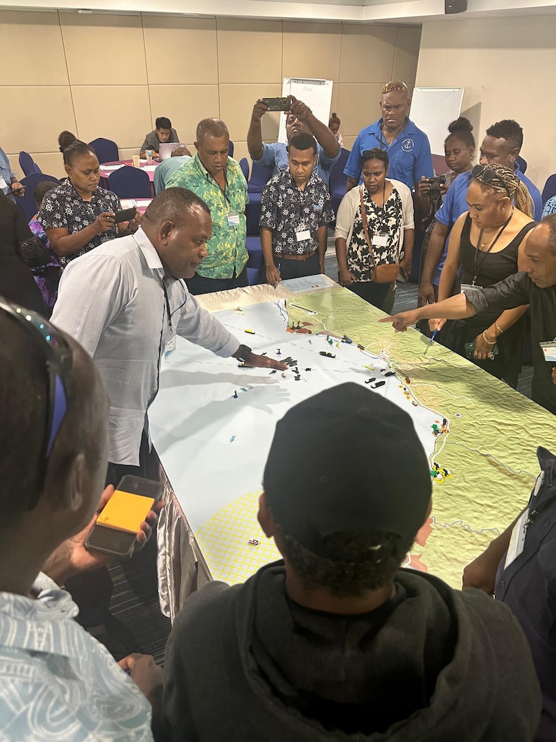 A representative from the Vanuatu Maritime Safety Authority addresses participants during a tabletop exercise at a marine pollution workshop in Honiara, Solomon Islands, Oct. 10, 2024. U.S. Coast Guard personnel with the Marine Environmental Response Regional Activity Center joined delegates from Solomon Islands, Vanuatu, Fiji, Kiribati, Australia, and Samoa to collaborate and prepare for marine pollution emergencies in the Pacific. (U.S. Coast Guard photo by Chief Warrant Officer 3 Shannon McGregor)