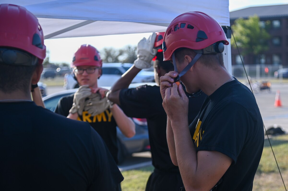 U.S. Army soldiers assigned to the 344th Intelligence Battalion gear up as they prepare to participate in the annual Fire Muster at Goodfellow Air Force Base, Texas, Oct. 11, 2024. Every year Goodfellow hosts events that highlight the critical role fire safety plays in protecting lives and communities. (U.S. Air Force photo by Airman 1st Class James Salellas)