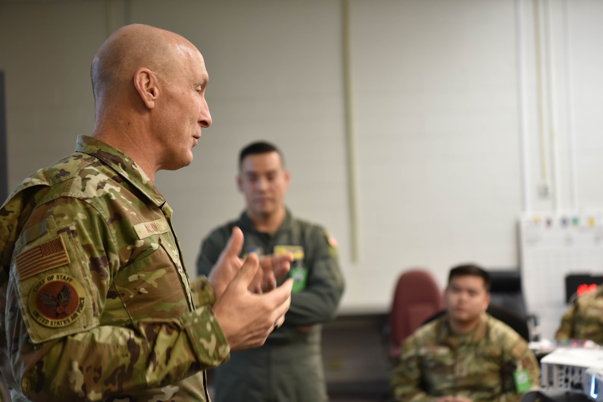 Air Force Chief of Staff Gen. David Allvin speaks to a group of Airmen.