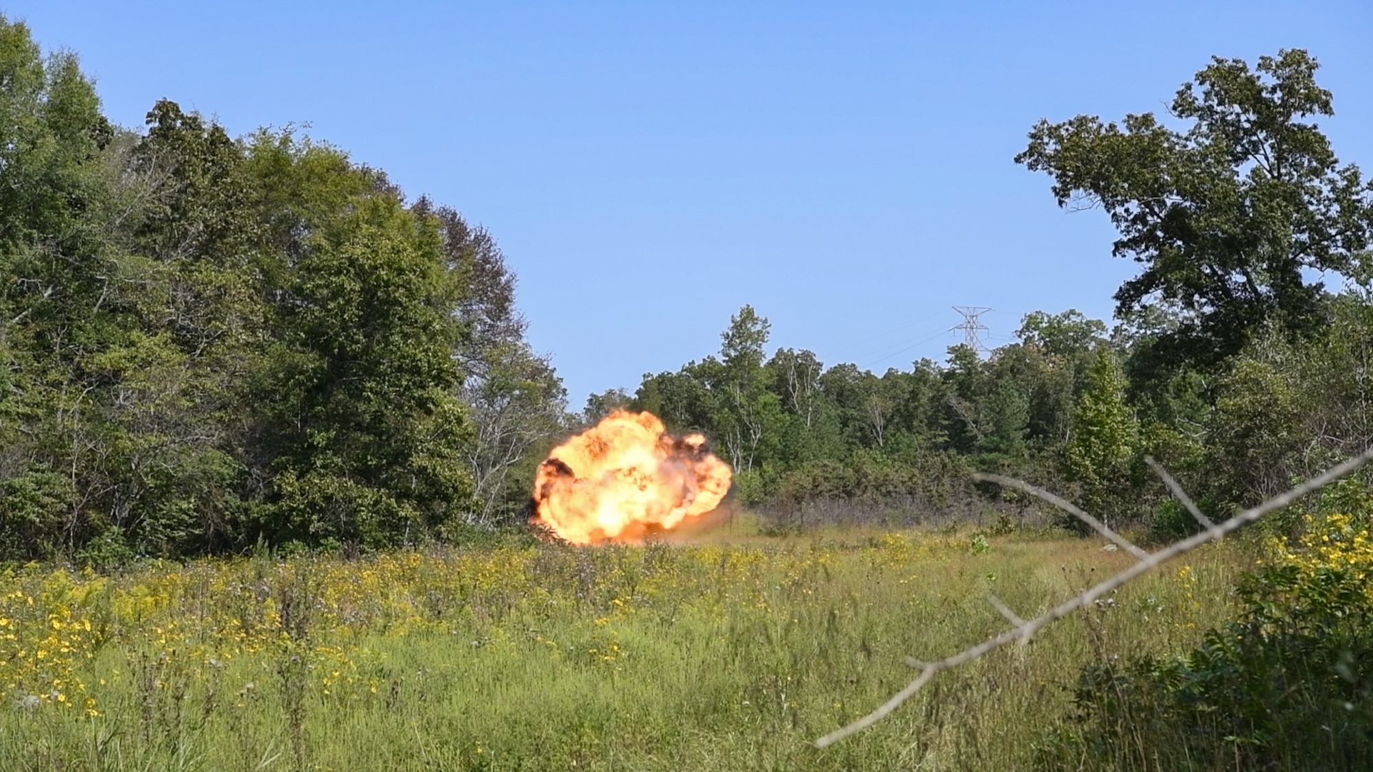 Leftover explosive test materials and items containing residue from a recent test are destroyed during an explosives disposal Sept. 10, 2024, at Arnold AFB, Tenn., headquarters of Arnold Engineering Development Complex. The 96th Civil Engineer Squadron Explosive Ordnance Disposal Flight from Eglin Air Force Base, Florida, helped plan both the testing and the disposal of the remaining explosives. These materials were detonated in a remote area of Arnold AFB using a charge of explosives. (U.S. Air Force still image pulled from video shot by Keith Thornburgh)