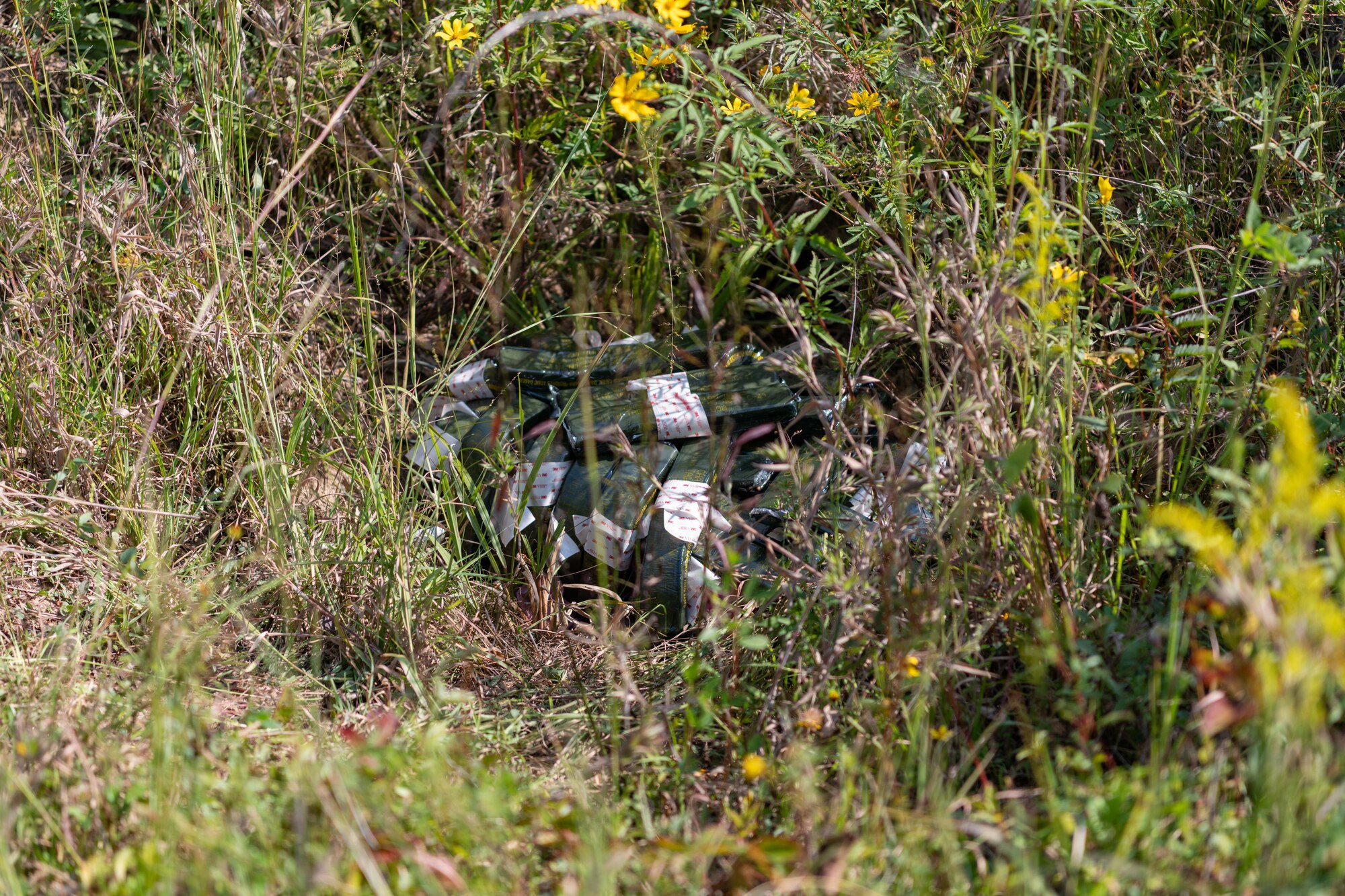 Leftover explosive materials from a recent test are prepared for disposal Sept. 10, 2024, at Arnold AFB, Tenn., headquarters of Arnold Engineering Development Complex. The 96th Civil Engineer Squadron Explosive Ordnance Disposal Flight from Eglin Air Force Base, Florida, helped plan both the testing and the disposal of the remaining explosives. These materials were detonated in a remote area of Arnold AFB using a charge of explosives. (U.S. Air Force still image pulled from video shot by Keith Thornburgh)