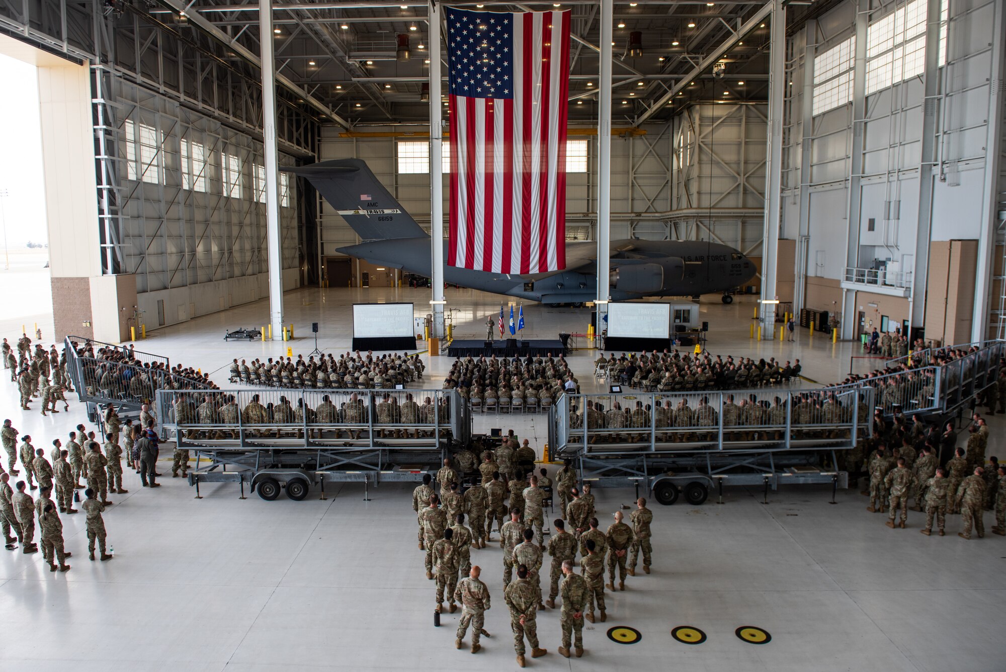 an overall photo of airmen and leaders gathering