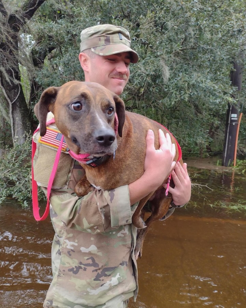 A Florida National Guard Soldier saves a dog after rescuing the dog’s owner, who was succumbing to hypothermia due to rising waters in the aftermath of Hurricane Milton.