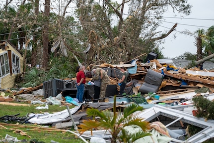 U.S. Soldiers assigned to Alpha Company, 1st Battalion, 124th Infantry Regiment, 53rd Infantry Brigade Combat Team, deliver water, meals and non-perishable goods to senior citizens in the Spanish Lake community in Port St. Lucie, Florida, Oct. 11, 2024.