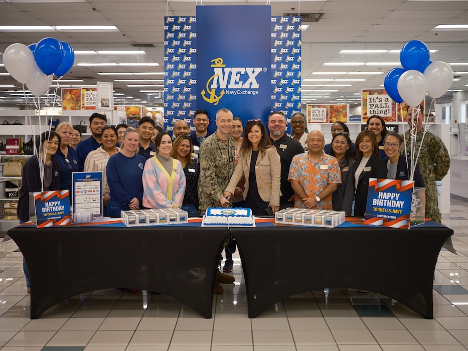 Commander, Fleet Activities Yokosuka Command Master Chief Dennis Hunt and Navy Exchange Yokosuka General Manager Charlene DuBose cut a ceremonial cake with Navy Exchange staff in honor of the U.S. Navy's 249th Birthday October 11, 2024.