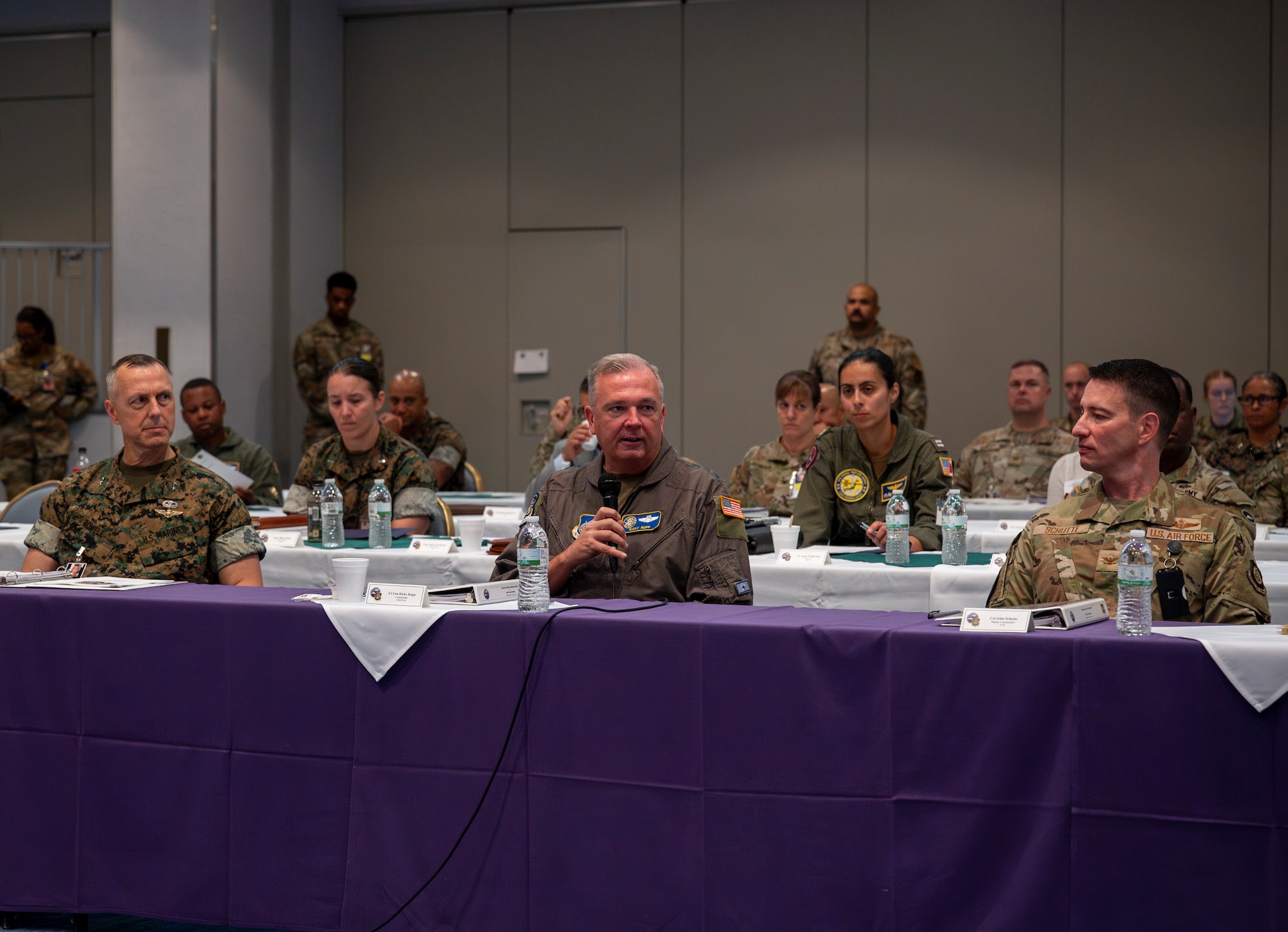U.S. Air Force Lt. Gen. Ricky Rupp, center, outgoing U.S. Forces Japan and 5th Air Force commander, delivers opening remarks during a combined commanders conference at Yokota Air Base, Japan, Oct. 7, 2024. The conference provided a streamlined environment to relay critical information and updates to leaders across the command. (U.S. Air Force photo by Senior Airman Samantha White)
