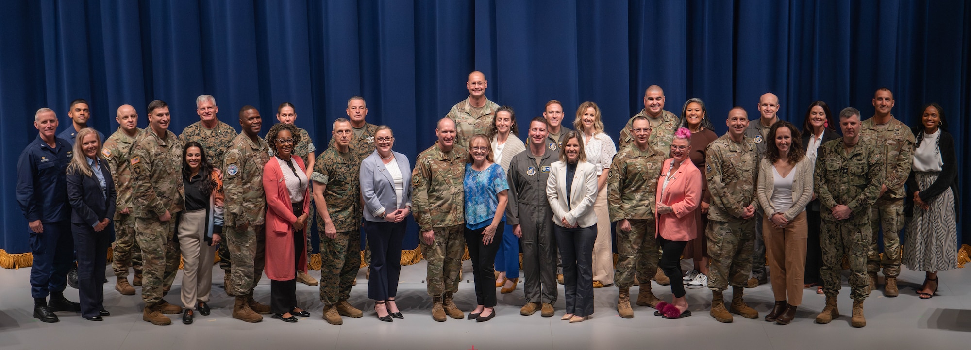 U.S. Forces Japan, Fifth Air Force, Yokota leadership and spouses take a group photo during a combined commanders conference at Yokota Air Base, Japan, Oct. 8, 2024. Commanders, senior enlisted leaders, and spouses from 24 units throughout the Indo-Pacific Region gathered to discuss military force structure, access to medical care and quality of life. (U.S. Air Force photo by Senior Airman Alexzandra Gracey)
