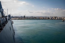 The San Antonio-class amphibious transport dock ship USS New York (LPD 21) enters port in Larnaca, Cyprus, Oct. 14, 2024. New York is conducting operations in the U.S. Naval Forces Europe and Africa (NAVEUR-NAVAF) area of operations as part of the Wasp Amphibious Ready Group (WSP ARG)-24th Marine Expeditionary Unit (MEU) Special Operations Capable (SOC). The WSPARG-24th MEU (SOC) is on a scheduled deployment to the NAVEUR-NAVAF area of operations, supporting U.S., Allied and partner interests in the region, including the Eastern Mediterranean Sea, to continue promoting regional stability and deterring aggression. (U.S. Navy photo by Mass Communication Specialist 2nd Class Jesse Turner)