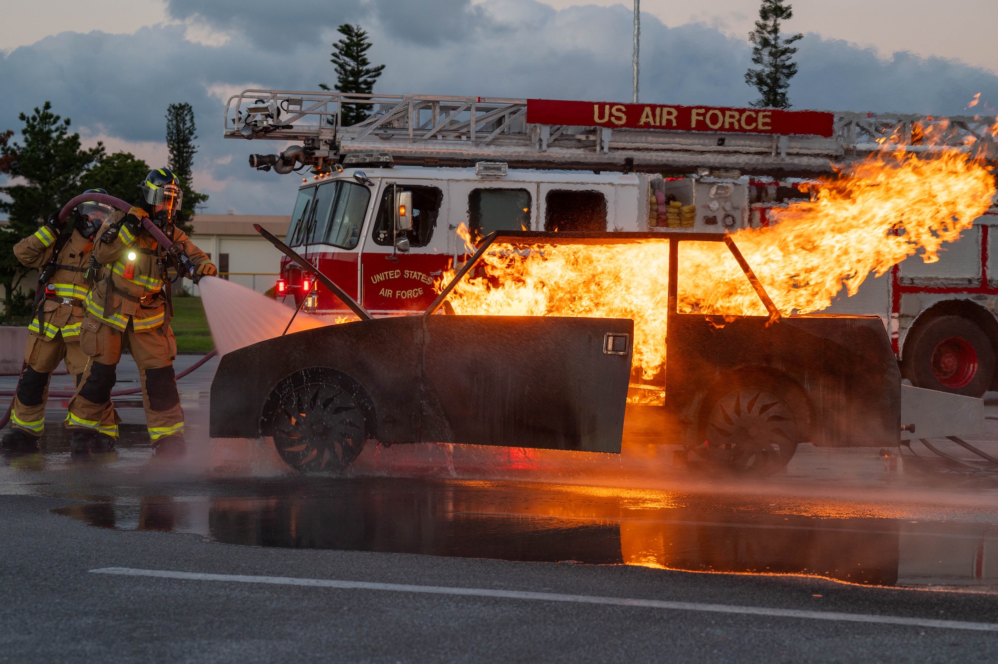 Firefighters fighting a simulated fire