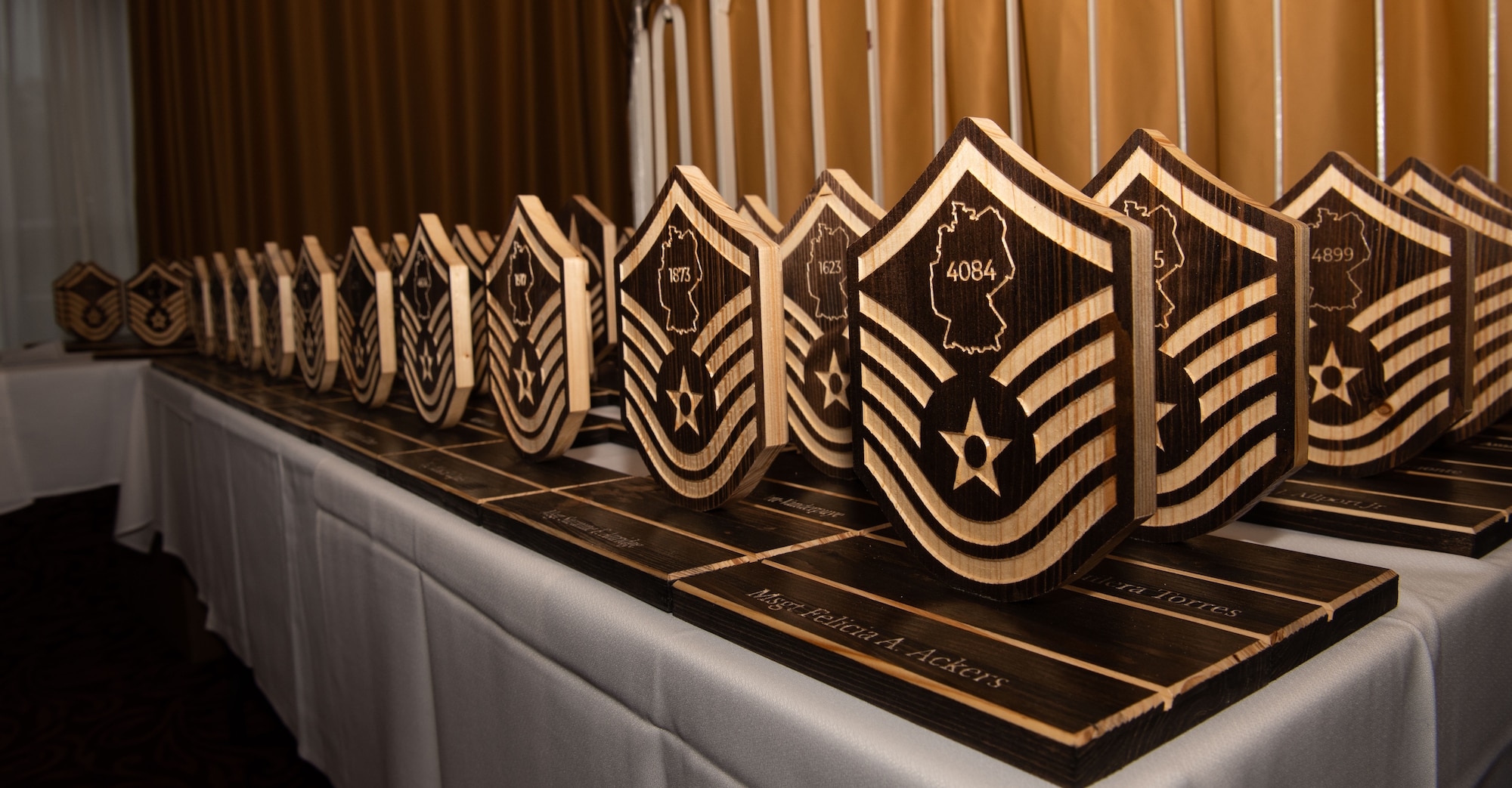 Mementos engraved with each senior noncommissioned officers’ line number is presented during the induction ceremony at Vogelweh Military Complex.