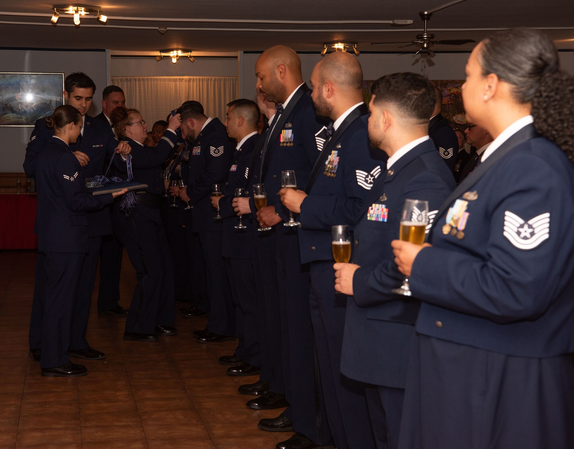 Medallions are placed on the senior noncommissioned officer inductees during the medallion ceremony.