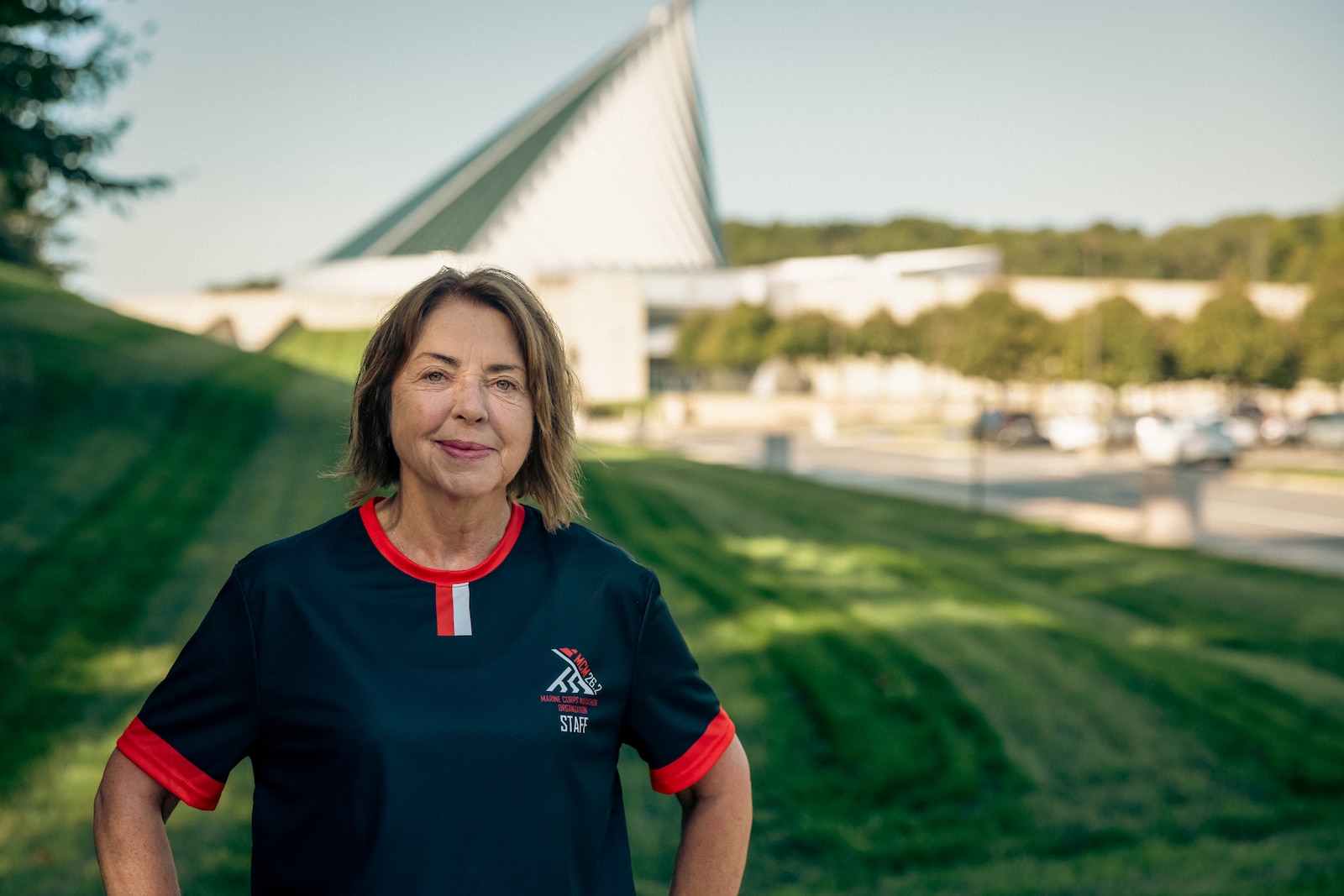 Angela Anderson, deputy director of the Marine Corps Marathon Office, poses for a photo at the National Museum of the Marine Corps, Triangle, Virginia, Oct. 7, 2024. Anderson, a German-American born on the west side of the Berlin wall, earned the title of a six-star runner this year. During her journey to become a six-star runner, she finally touched ground on the East side of the wall. “The discomfort running a long-distance race – physically or mentally – is nothing in comparison with what the people of my country of origin had to experience during their very difficult times.”