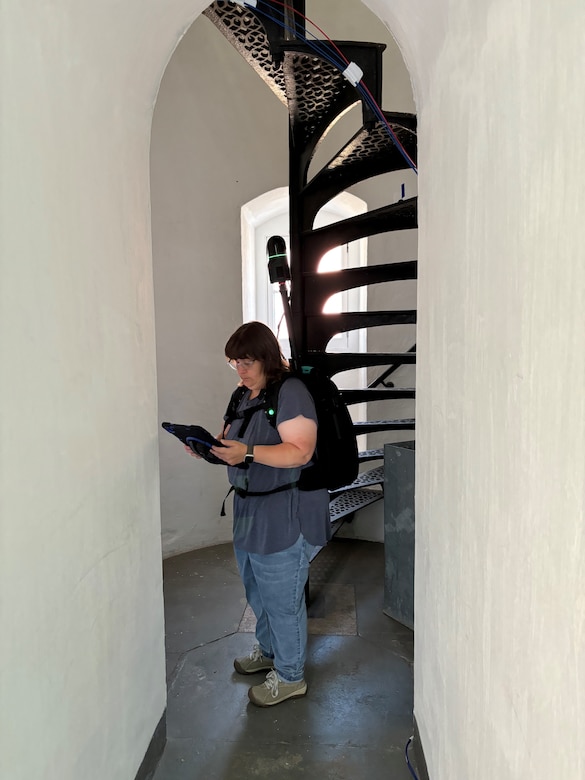 Carey Baxter, archaeologist and 3D scan lead at ERDC-CERL, gathering scan data of the Au Sable Lighthouse