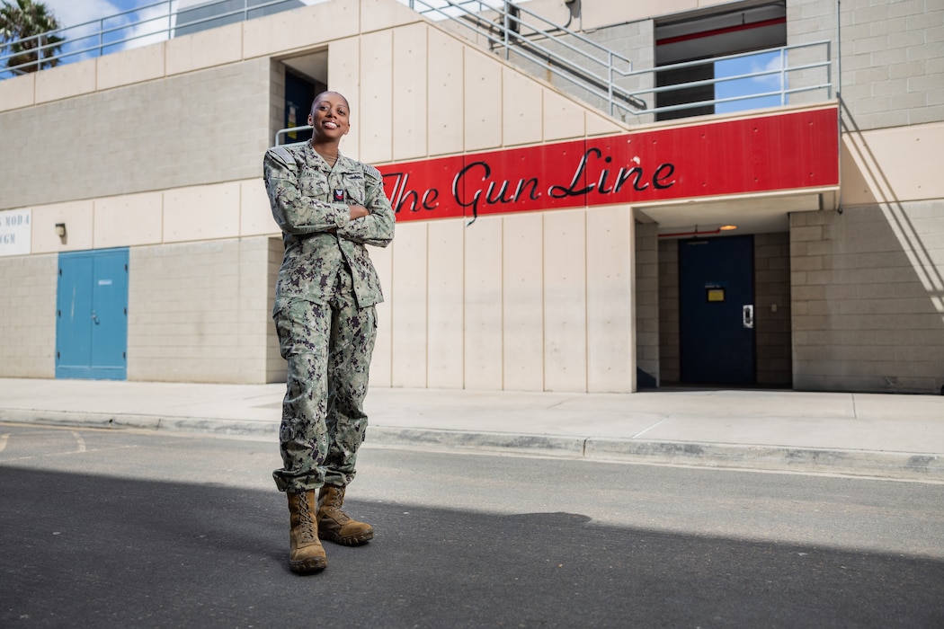 Gunner's Mate 1st Class DeAngela Smith, assigned to Surface Combat Systems Training Command (SCSTC), poses for a portrait at the The Gun Line onboard Naval Base San Diego on Sept. 20, 2024. Smith is an instructor for the Mk 45 MOD 2 Gun Weapons System at SCSTC, preparing sailors for their operational roles within the U.S. Navy. (U.S. Navy photo by Austen McClain)