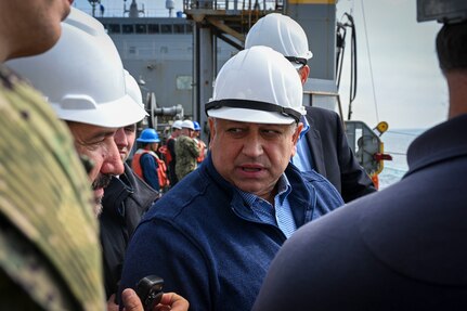 SECNAV Carlos Del Toro visits USNS Washington Chambers (T-AKE 11) during a demonstration of VLS reloading at-sea with USS Chosin (CG-65).