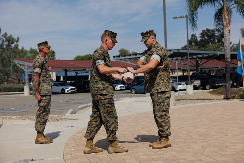 U.S. Marine Corps Sgt. Maj. Casey J. Pilkington, Wounded Warrior Battalion West battalion senior enlisted leader, speaks during a relief and appointment ceremony at Marine Corps Base Camp Pendleton, Calif., Oct. 4, 2024. During the ceremony, Sgt. Maj. Robert L. Leatherman relinquished the responsibility of command senior enlisted leader for Wounded Warrior Battalion West to Sgt. Maj. Casey J. Pilkington. The ceremony represents the transfer of authority and accountability from the outgoing command senior enlisted leader to the incoming command senior enlisted leader. (U.S. Marine Corps photo by Lance Cpl. Jeslianne A. Torres).