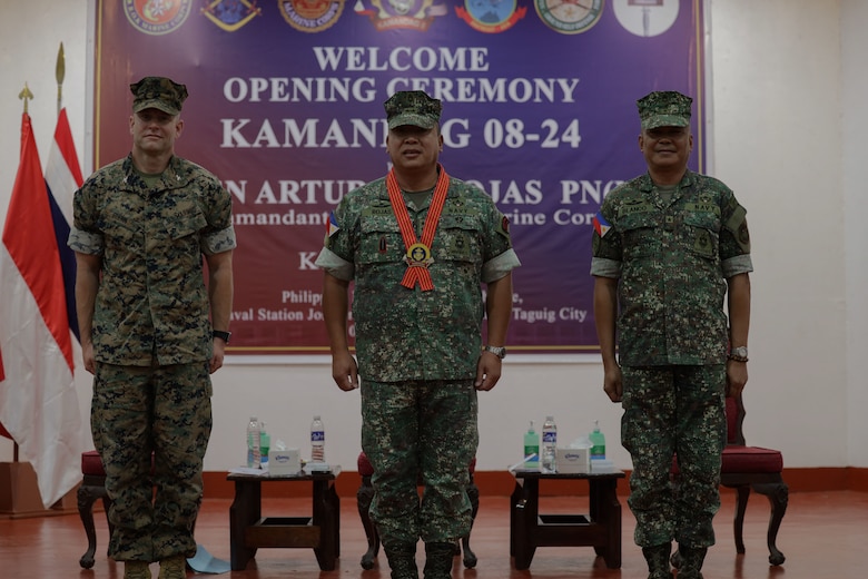 From left, U.S. Marine Corps Col. Stuart Glenn, commanding officer for Marine Rotational Force-Southeast Asia, Philippine Marine Corps Maj. Gen. Arturo G Rojas, commandant of the Philippine Marine Corps, and Philippine Marine Corps Brig. Gen. Vicente Map Blanco III, director, exercise directorate headquarters, pose for a photo during the opening ceremony for KAMANDAG 8 at Fort Bonifacio, Manila, Philippines, Oct. 15, 2024. KAMANDAG is an annual Philippine Marine Corps and U.S. Marine Corps-led exercise aimed at enhancing the Armed Forces of the Philippines’ defense and humanitarian capabilities by providing valuable training in combined operations with foreign militaries in the advancement of a Free and Open Indo-Pacific.